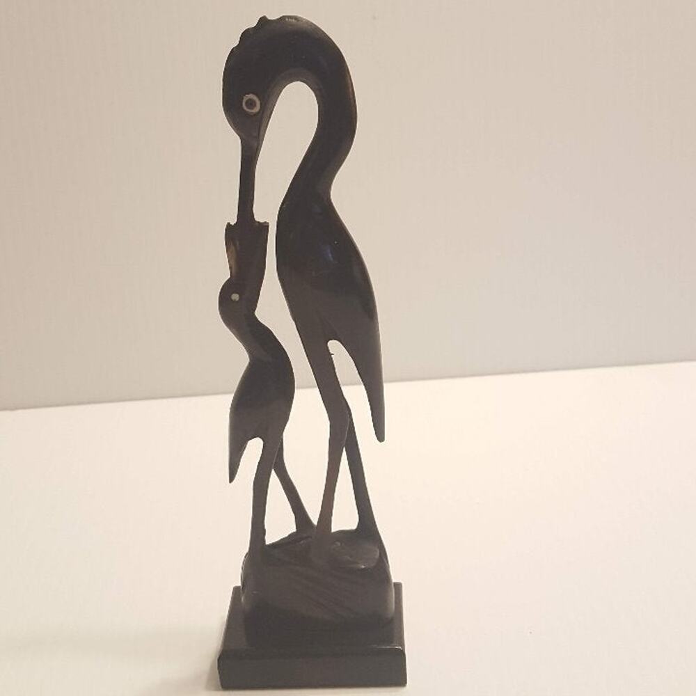 Vintage Stork Bone Figurine feeding a chick. Pre-owned, great shape.
